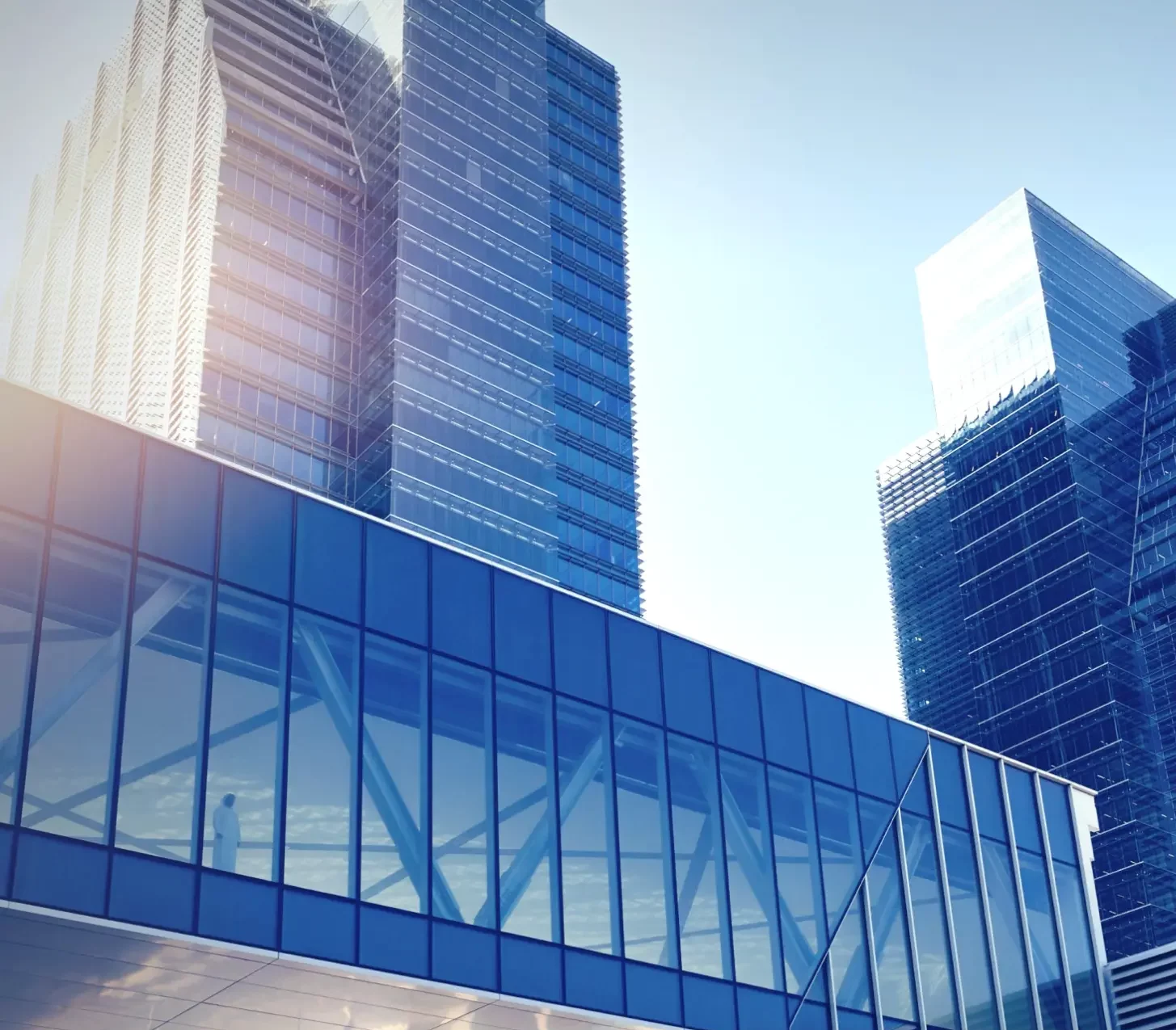 External Asset Managers 1 A large building featuring an expansive glass window, reflecting its modern architectural design.