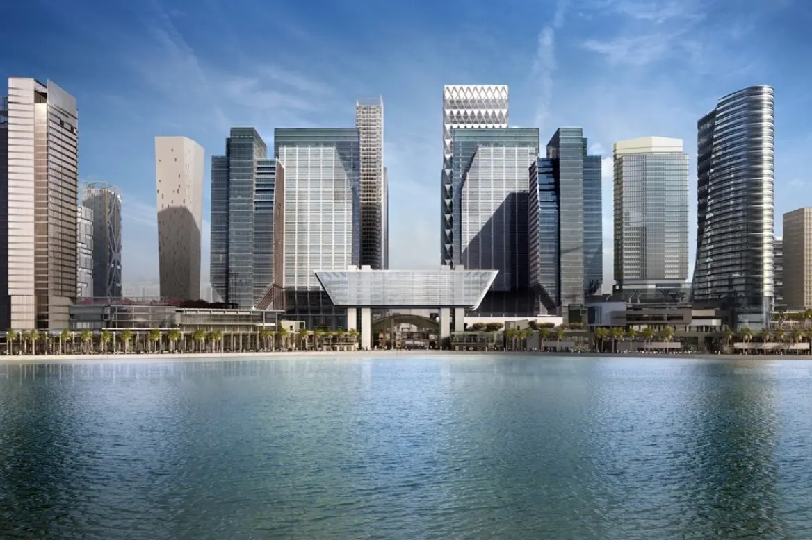 Funds 1 A tall building featuring a sleek glass facade that reflects its surroundings.